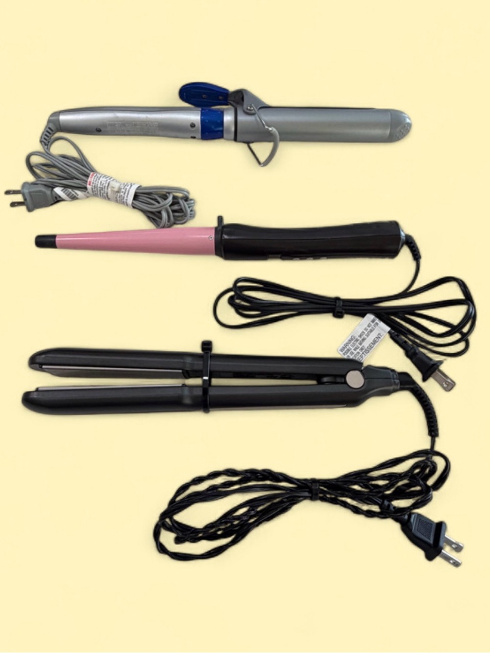 Set of Three Hair Styling Tools - Curling Iron and Flat Irons.